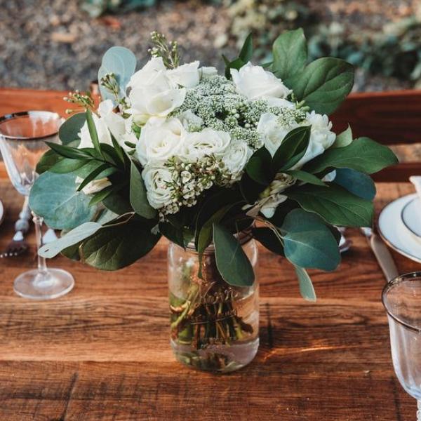 Elegant white flower mason jar display