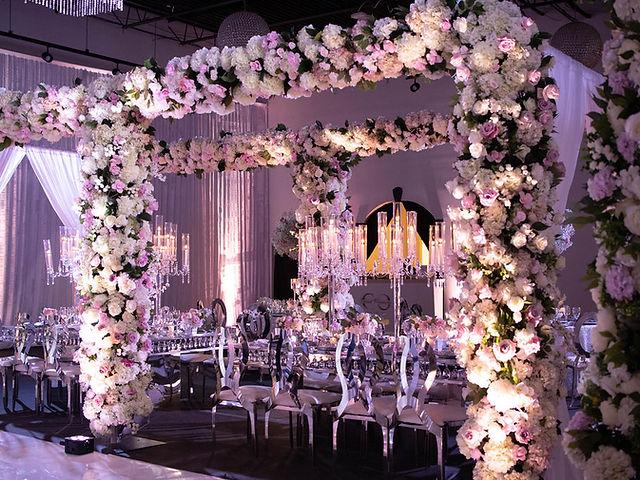 Floral arch wedding reception decorations with white blooms