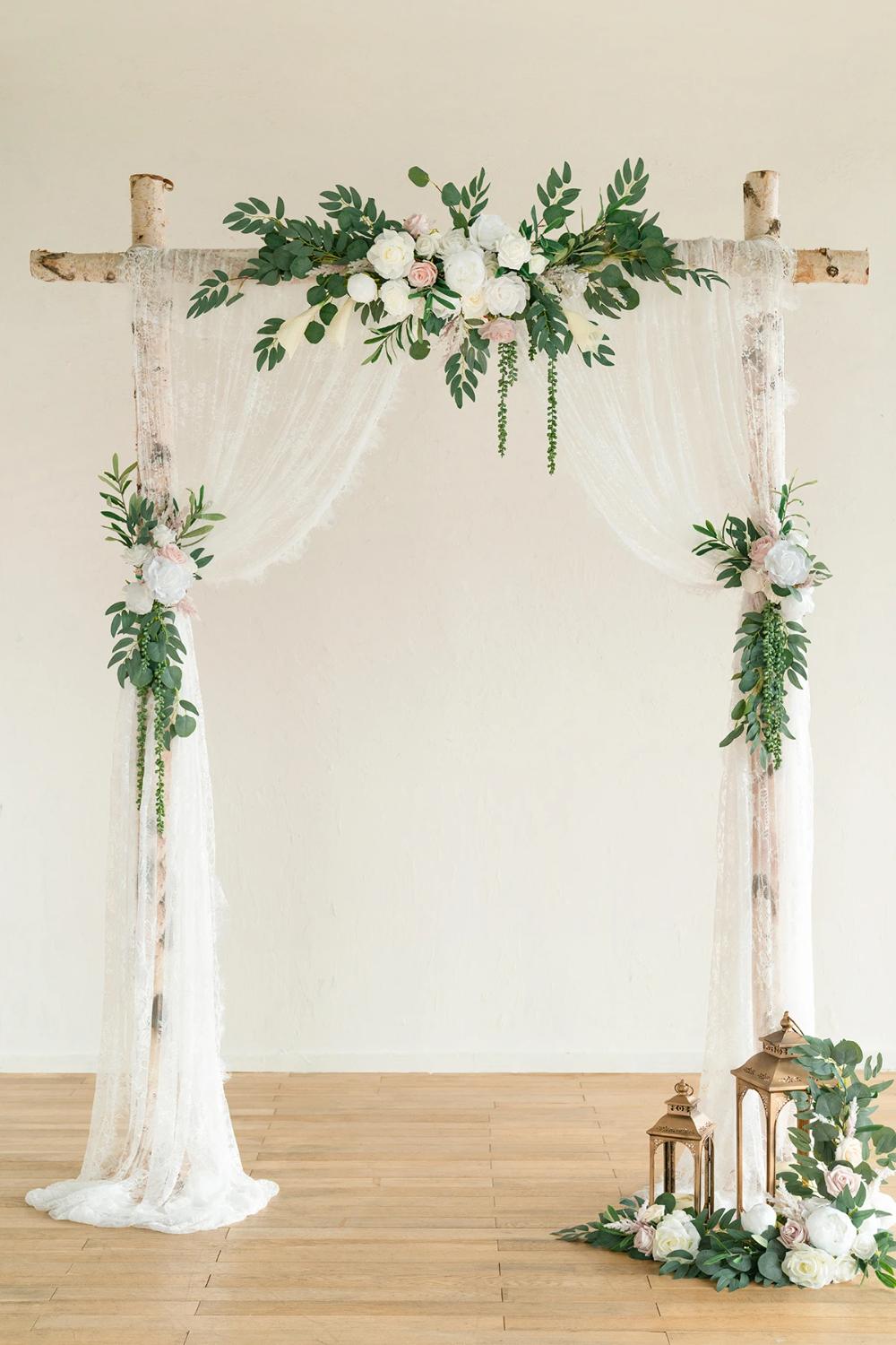 DIY wedding arch with greenery and floral arrangement