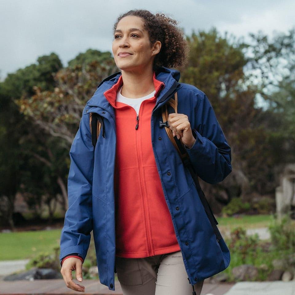 Woman wearing layered hiking clothing