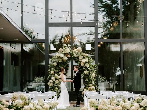 Modern couple exchanging wedding vows
