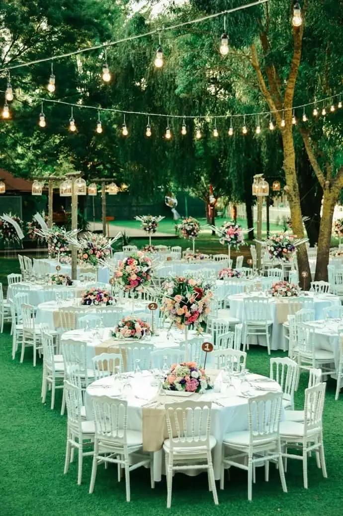 Minimal white wedding reception decorations and tables