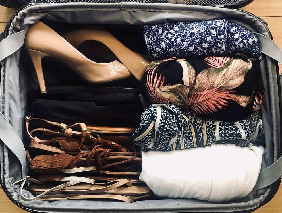 Shoes around suitcase edges
