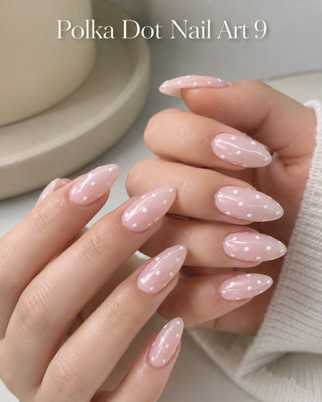 Milky pink polka dot nail art with soft white dots for a subtle bridal manicure