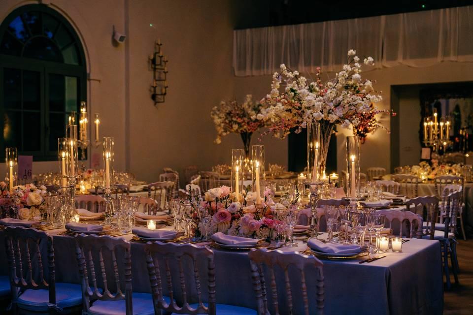 Candlelit wedding reception decorations in banquet hall